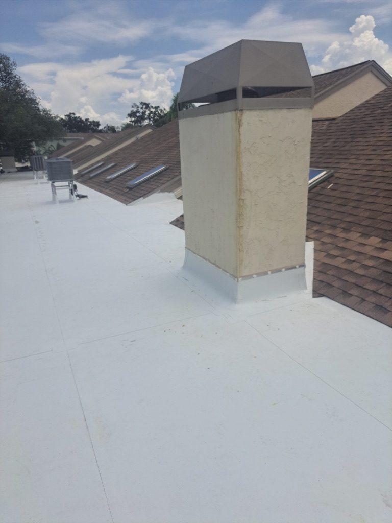 Commercial TPO roof with chimney flashing in Tampa by Happy Roof